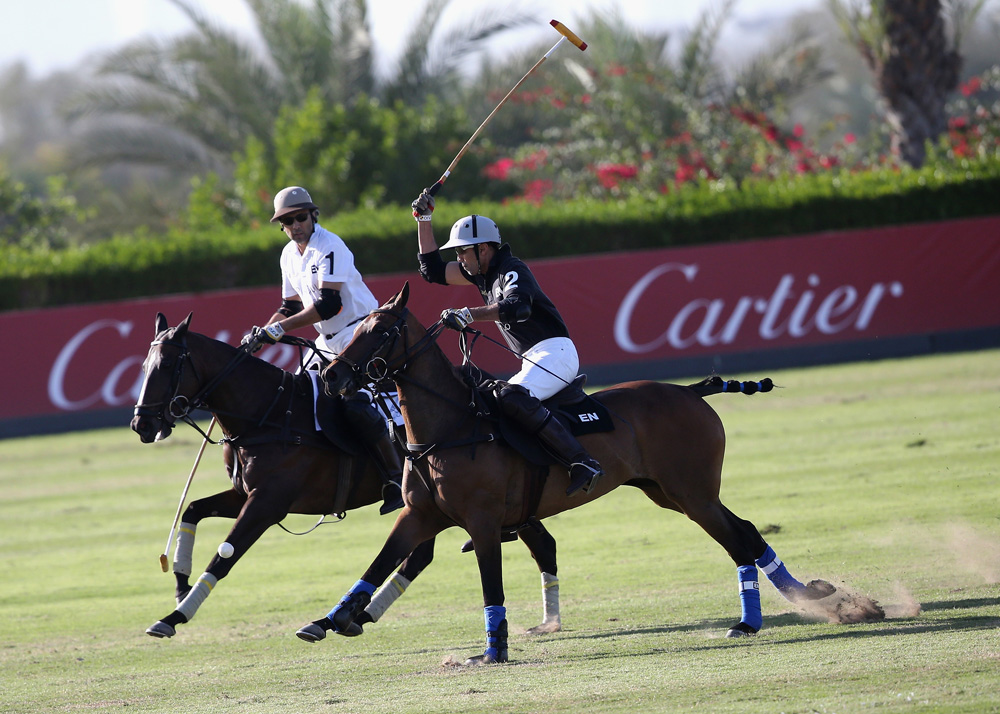 DUBAI, UNITED ARAB EMIRATES - DECEMBER 12:  Desert Palm polo team fights for the ball with the Habtoor team on the final day of Cartier International Dubai Polo Challenge 11th edition at Desert Palm Hotel on December 12, 2015 in Dubai, United Arab Emirates. The event takes place under the patronage of HRH Princess Haya Bint Al Hussein, Wife of HH Sheikh Mohammed Bin Rashid Al Maktoum, Vice-President and Prime Minister of the UAE and Ruler of Dubai. The Cartier International Dubai Polo Challenge is one of the most prestigious happenings in Dubai's sporting and social calendar.  (Photo by Chris Jackson/Getty Images for Cartier)